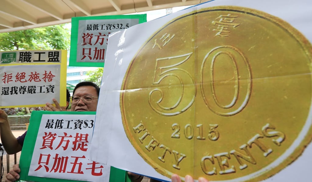 Members of the Hong Kong Confederation of Trade Unions call for a higher minimum wage. Photo: Edward Wong