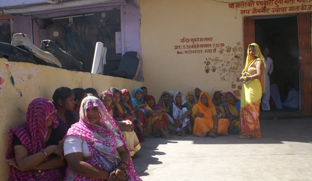 The women of Alwar in their colourful robes, wait to enter a local temple. Photo: Amrit Dhillon