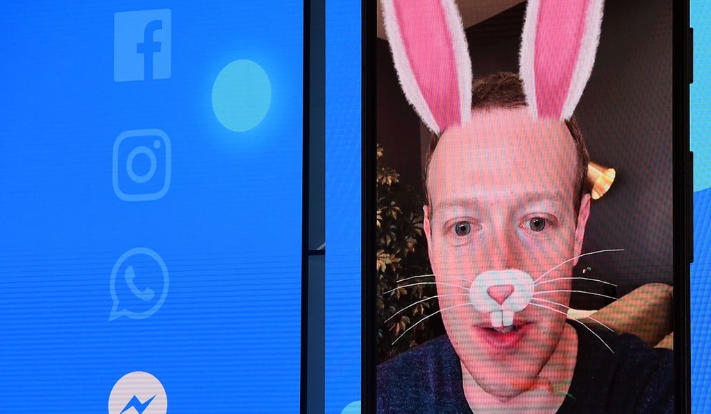 Facebook CEO Mark Zuckerberg is seen with digital bunny ears on-screen during the annual F8 summit at the San Jose McEnery Convention Center in San Jose, California on Tuesday. F Zuckerberg announced the world's largest social network will soon include a new dating feature. Photo: Agence France-Presse