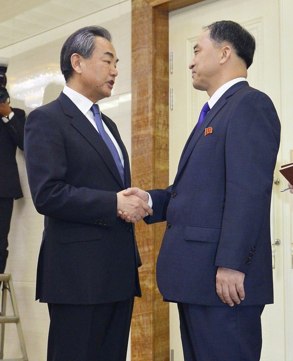 Chinese Foreign Minister Wang Yi (left) is greeted by the North’s Deputy Foreign Minister Ri Kil-song at Pyongyang airport. Photo: Kyodo Chinese Foreign Minister Wang Yi (left) is greeted by the North’s Deputy Foreign Minister Ri Kil-song at Pyongyang airport. Photo: Kyodo
