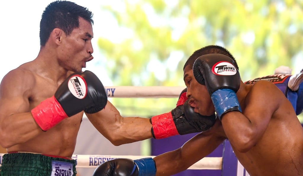 Thai boxer Wanheng Menayothin connects with a left hand against Leroy Estrada.