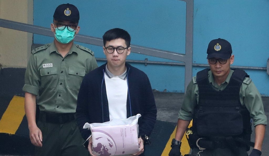 Keith Lau (centre) is seen being escorted away. Photo: Winson Wong