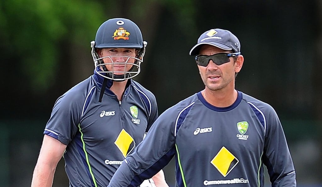 New Australia coach Justin Langer (right). Photo: AFP
