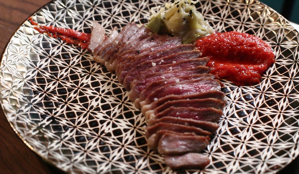 Iberico secreto with grilled leeks and creme de piquillos. Photo: Edmond So