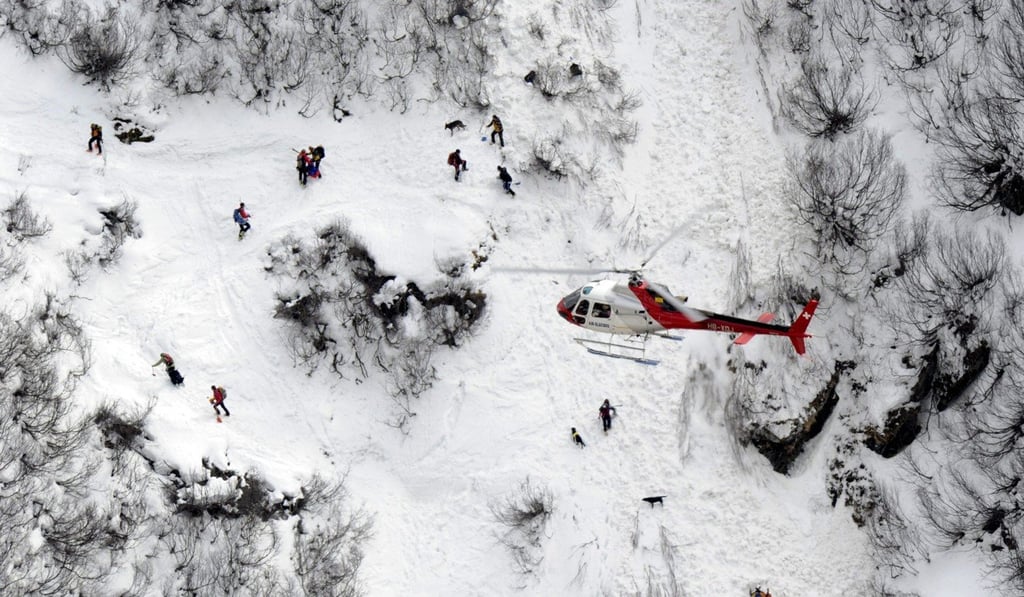 A rescue operation in 2011 near the canton of Valais. One person died overnight and three died later in hospital caught out in the storm in a similar location this week. Photo: EPA
