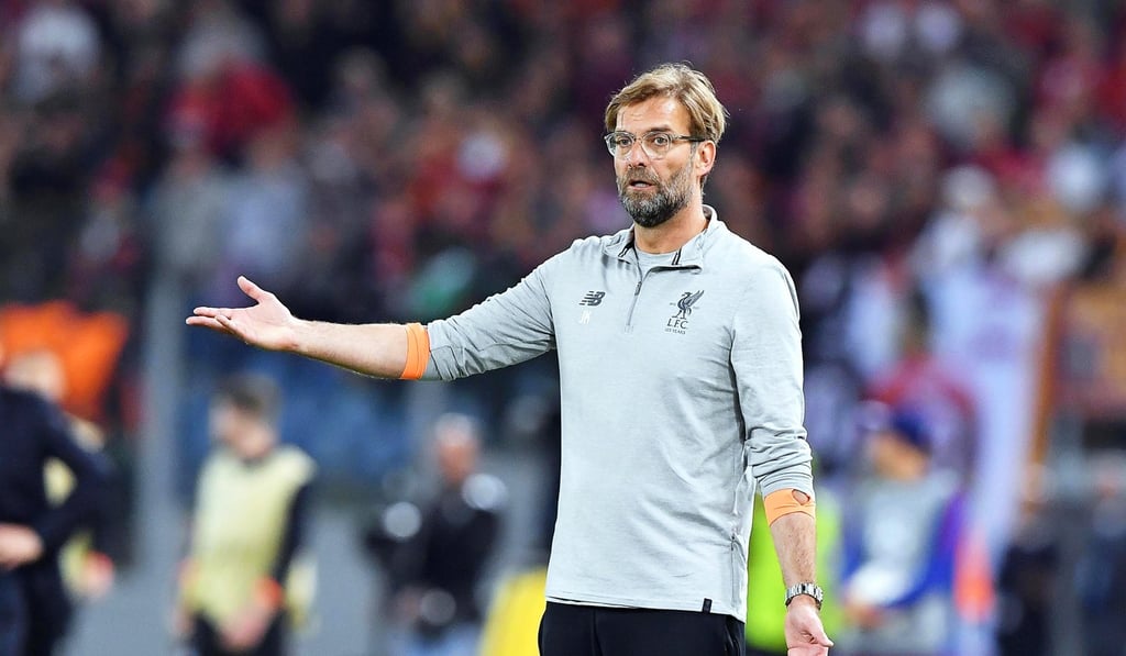 An incredulous Jurgen Klopp looks on.