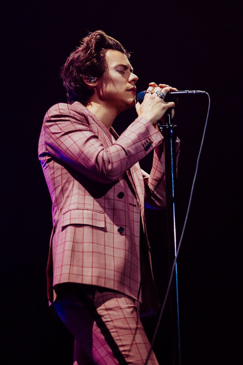 Styles in a Calvin Klein check suit in Stockholm in March 2018.