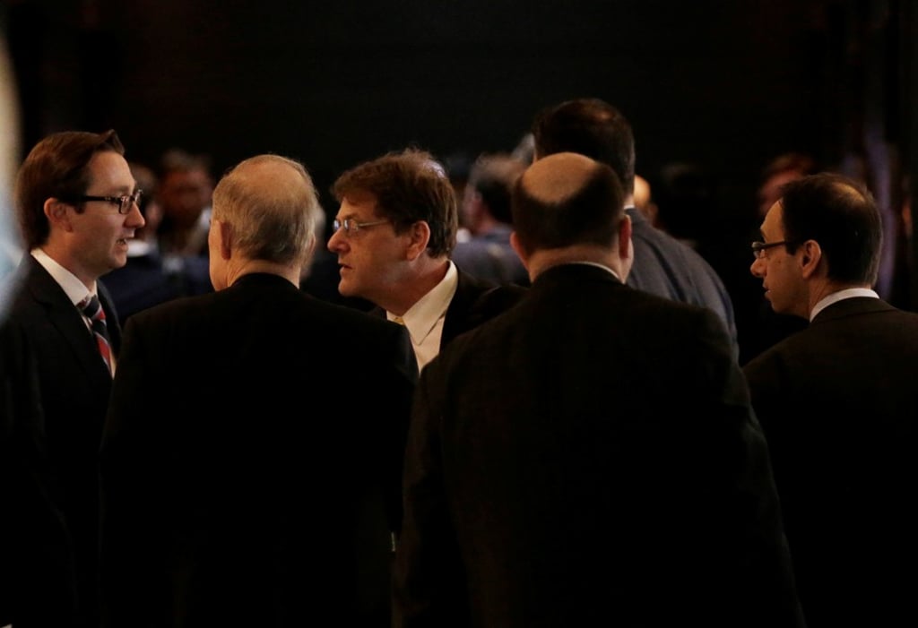 Members of a US delegation for trade talks with China arrive at a hotel in Beijing, China on Thursday. Photo: Reuters