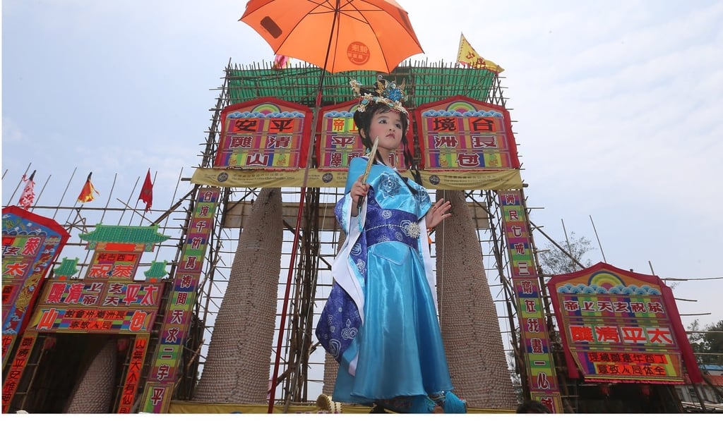 A dressed-up child takes part in the annual Piu Sik Parade on Cheung Chau. Photo: K.Y. Cheng A dressed-up child takes part in the annual Piu Sik Parade on Cheung Chau. Photo: K.Y. Cheng