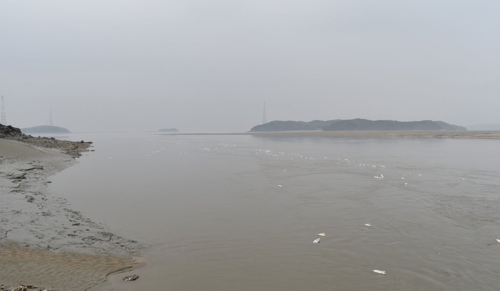 Bottles containing rice, bibles and USB drives float towards North Korea. Photo: John Power