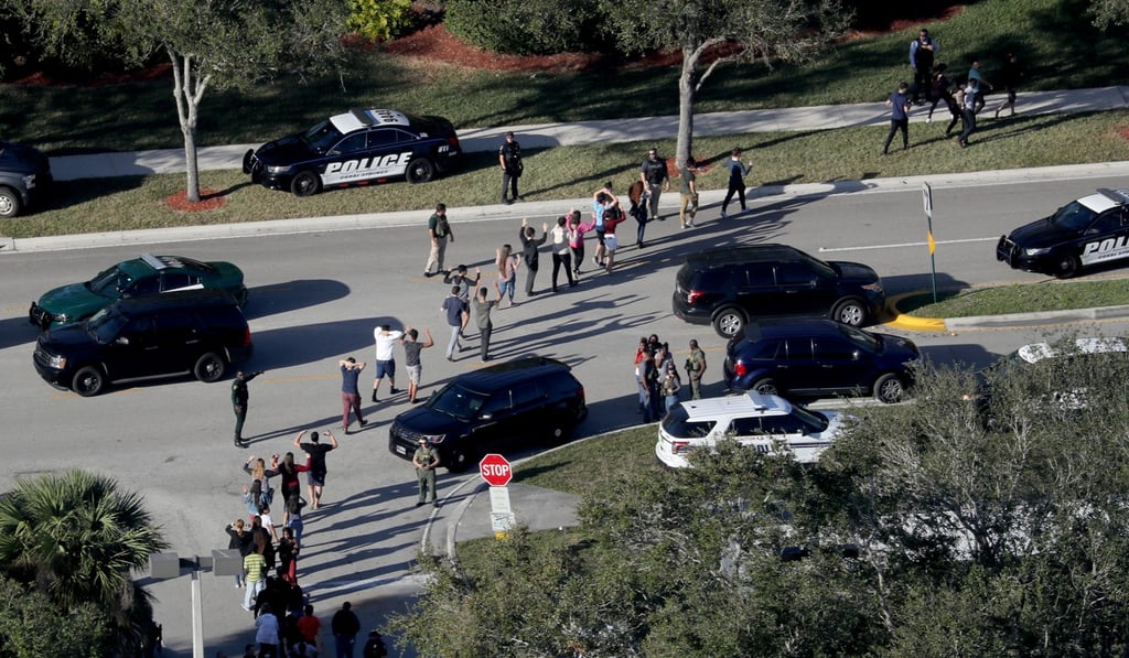 Students being evacuated by police out of Stoneman Douglas High School in Parkland, Florida after a shooting on February 14. Photo: Sun Sentinel via TNS