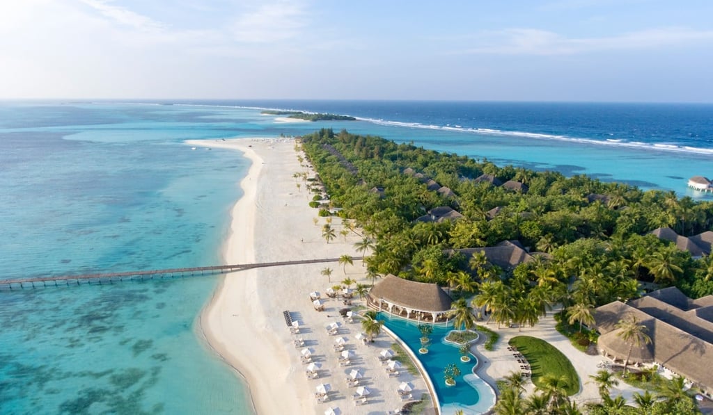 Kanuhara is surrounded by crystal clear waters and palm-dotted, powder-fine sands.