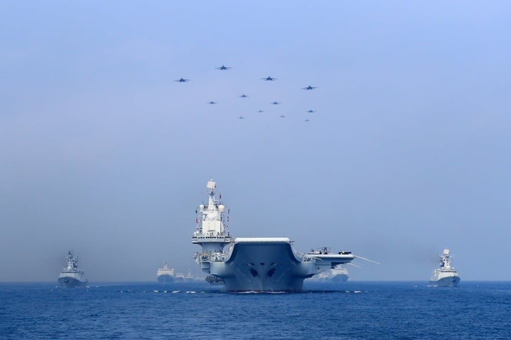 Chinese warships and fighter jets take part in a military display in the South China Sea on April 12. Photo: Reuters