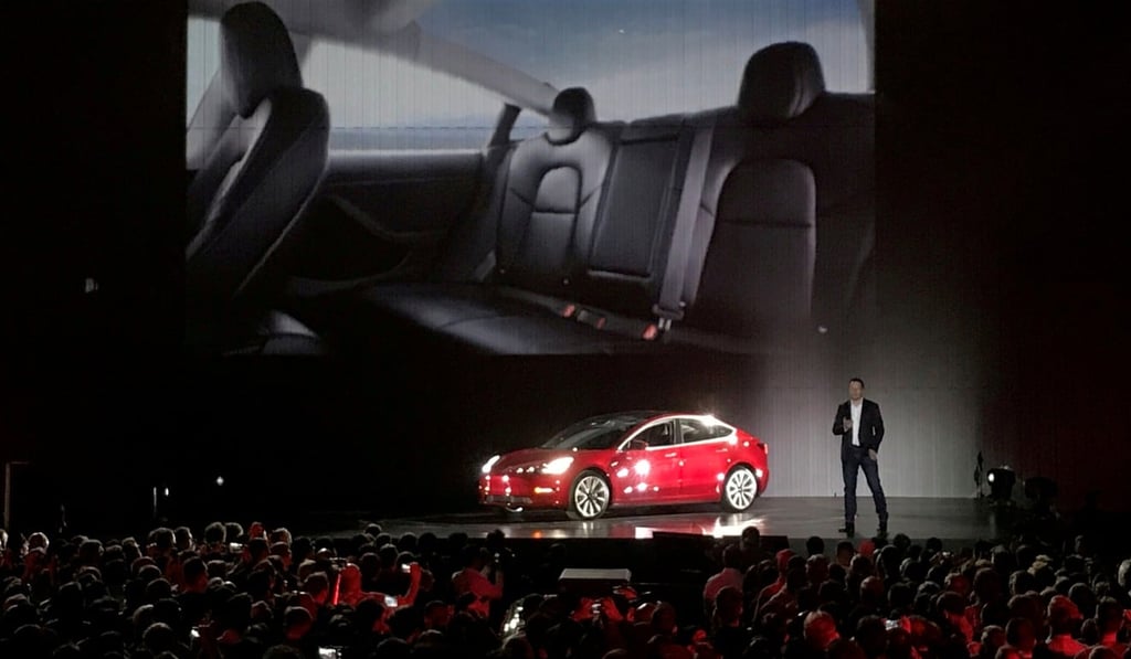 Tesla Chief Executive Elon Musk introduces one of the first Model 3 cars off the factory's production line during an event at the company's facilities in Fremont, California in July 2017. Photo: Reuters