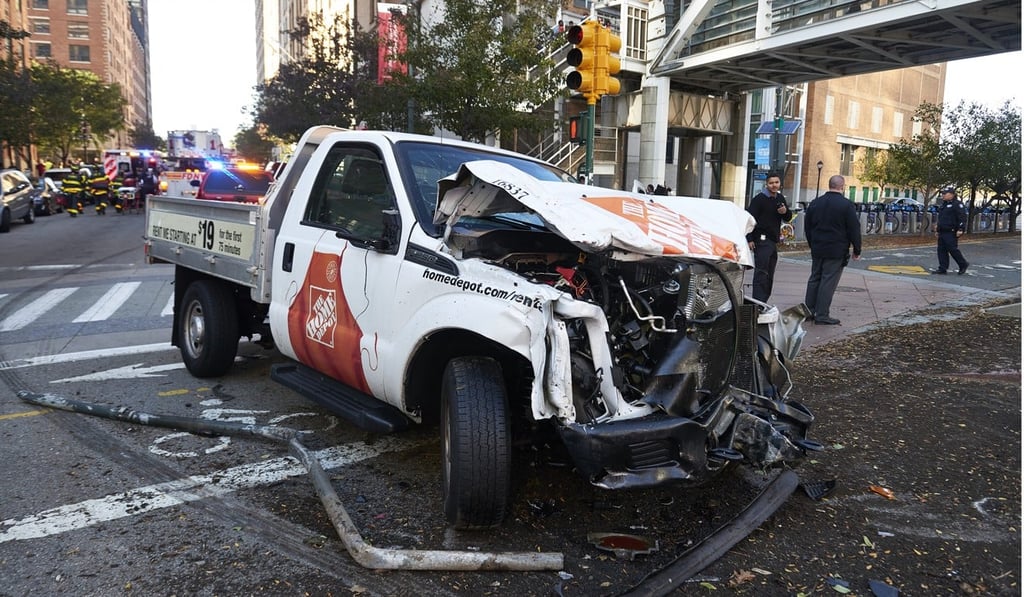 Scene after a gunman emerged from a crashed truck and opened fire after apparently ploughing down four people on a Lower Manhattan bike path on October 31, 2017. Photo: TNS