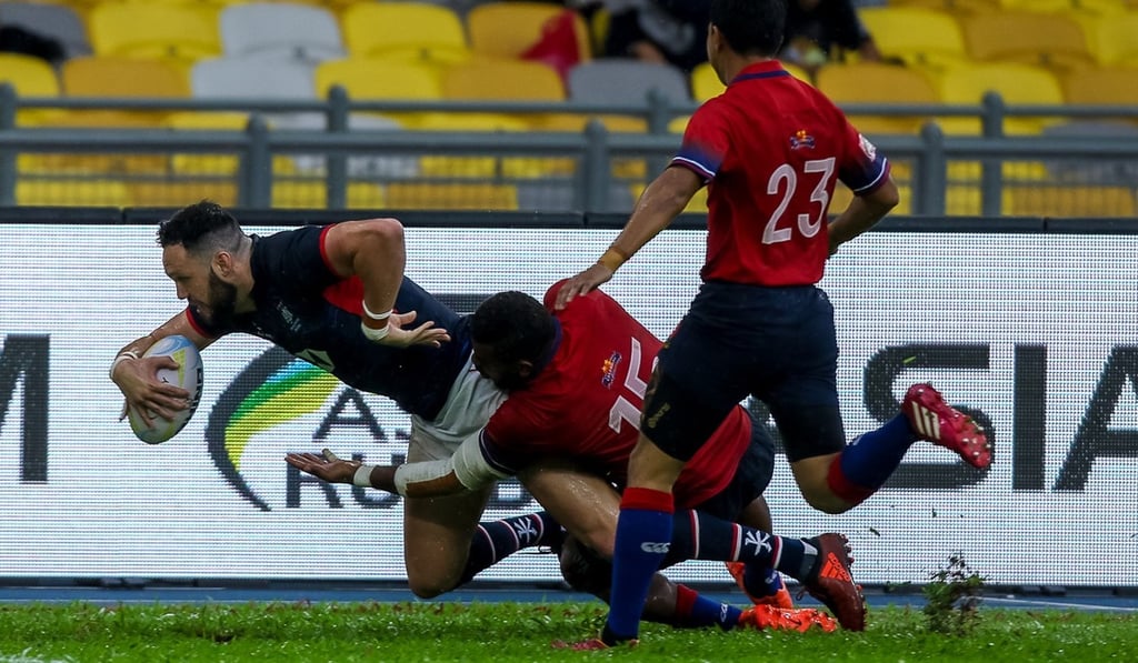 Cono Hartley touches down for Hong Kong against Malaysia. Cono Hartley touches down for Hong Kong against Malaysia.