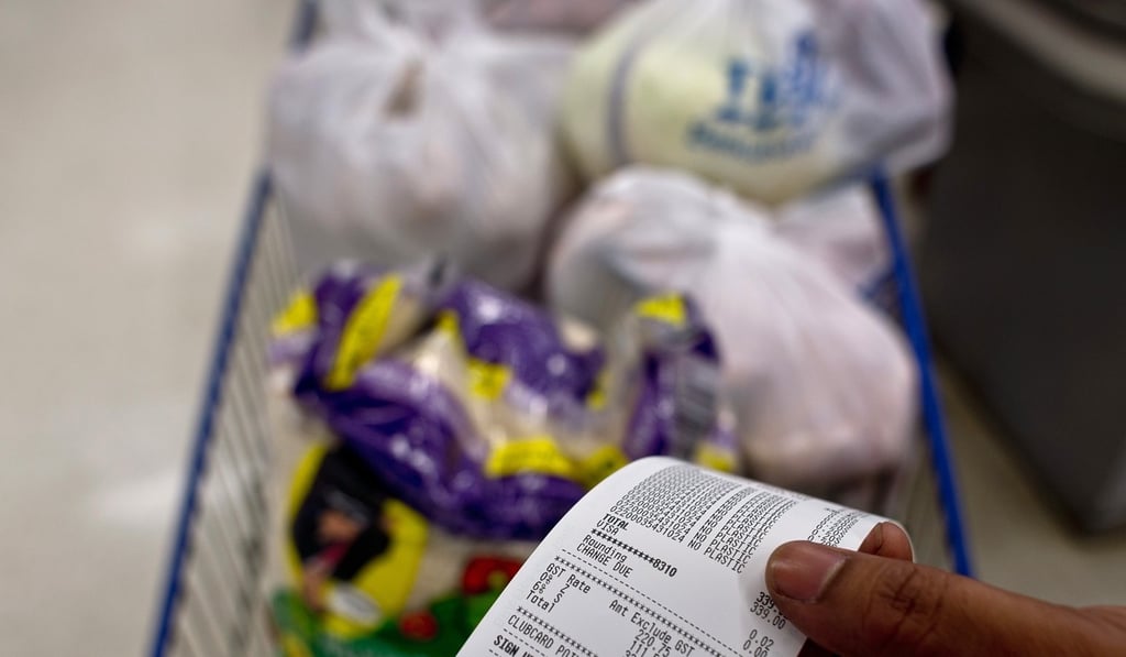 A grocery receipt with the added six per cent goods and services tax (GST) at a department store in Kuala Lumpur. Photo: AFP