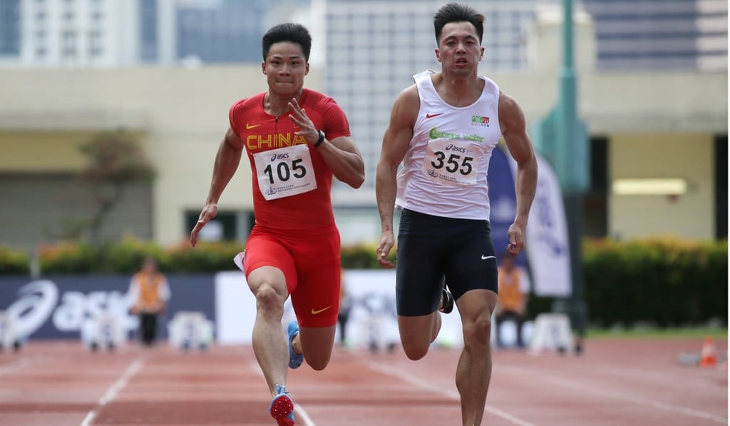 Su Bingtian (left) outsprints Hong Kong’s Ng Ka-fung on his way to victory in the men’s 100 metres.