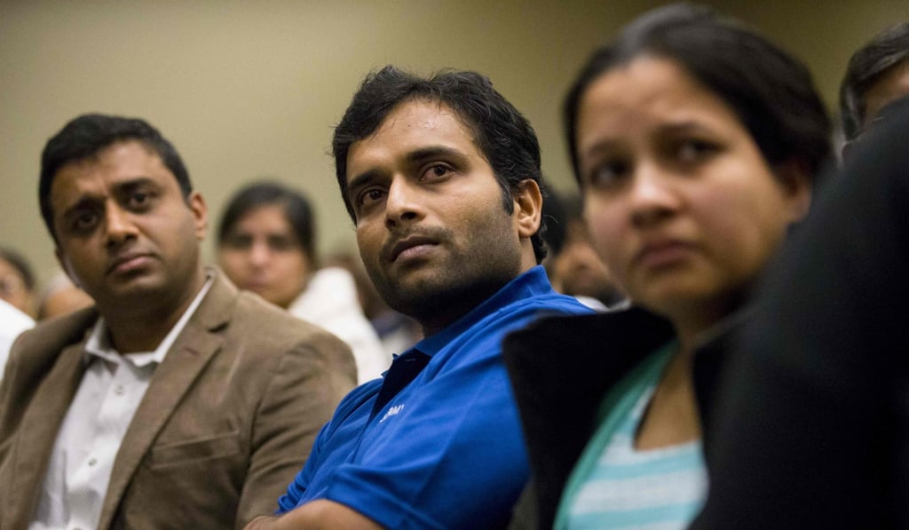 Alok Madasani, a victim in the Kansas attack, listens as the sister of victim Ian Grillot addresses a prayer vigil at the Ball Conference Center in Olathe, Kansas on January 22, 2017. Photo: AFP / Getty Images North America Alok Madasani, a victim in the Kansas attack, listens as the sister of victim Ian Grillot addresses a prayer vigil at the Ball Conference Center in Olathe, Kansas on January 22, 2017. Photo: AFP / Getty Images North America