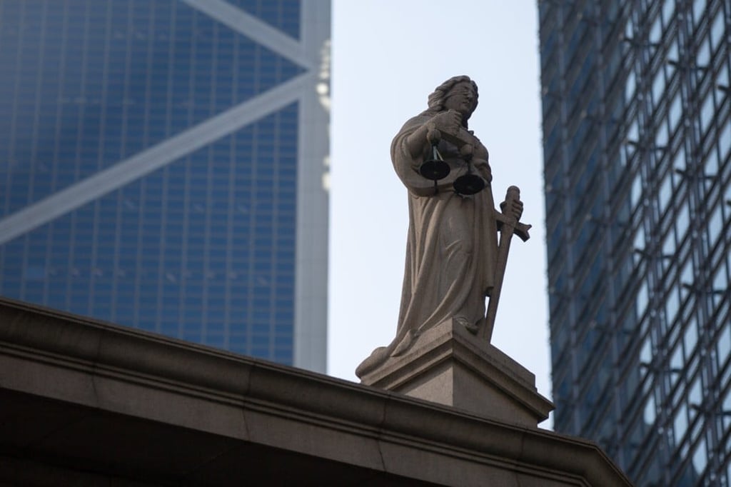 A statue representing justice stands on top of the Court of Final Appeal in Hong Kong in January 2018. Photo: EPA-EFE