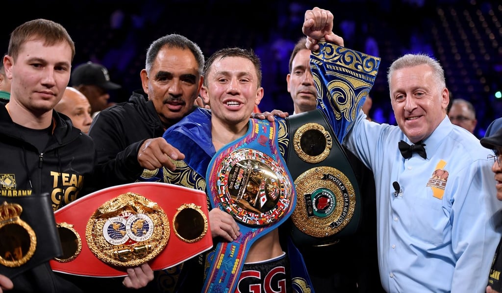 Gennady Golovkin poses with his belts after a second round knockout win over Vanes Martirosyan. Photo: AFP