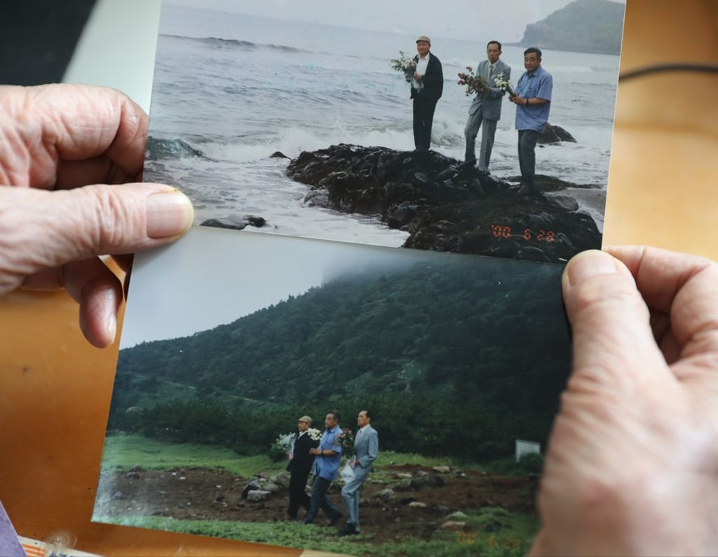 Zhang Zeshi, an 89-year-old People's Volunteer Army veteran, shows two photographs of him and two other veterans paying tribute at Jeju Island in 2000 to Chinese soldiers who died as prisoners in the Korean war. Photo: Simon Song