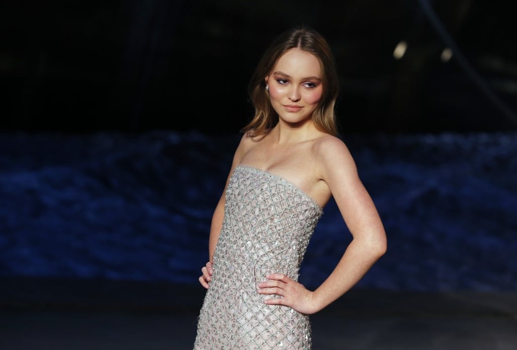 Model Lily-Rose Depp poses for photographers at Chanel's Cruise collection fashion show in Paris last Thursday. Photo: AP