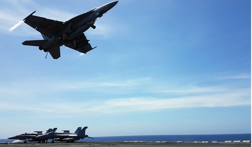An F18 fighter takes off from the deck of the USS Theodore Roosevelt in the South China Sea. America’s military force is key to its influence in Asia. Photo: Reuters