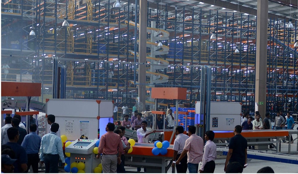 Indian employees look on during the launch of Flipkart's largest fulfilment centre on the outskirts of Hyderabad in 2015. India’s e-commerce market is forecast to reach US$200 billion in about a decade, according to Morgan Stanley. Photo: Agence France-Presse
