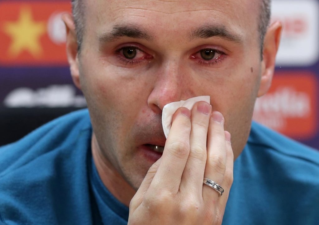 Andres Iniesta has tears in his eyes as he announces his departure from Barcelona at a press conference. Photo: Reuters