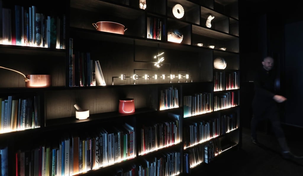 Book shelves at the entrance to Écriture. Photo: Jonathan Wong