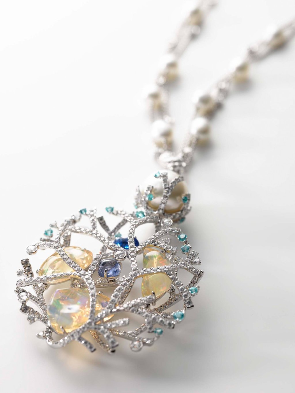 Mikimoto’s ‘Praise to Nature’ necklace in 18ct white gold, white South Sea cultured pearls, opals and spinels.