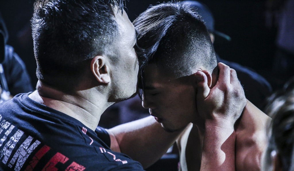 Christian Lee is greeted by his father ahead of his most recent fight.