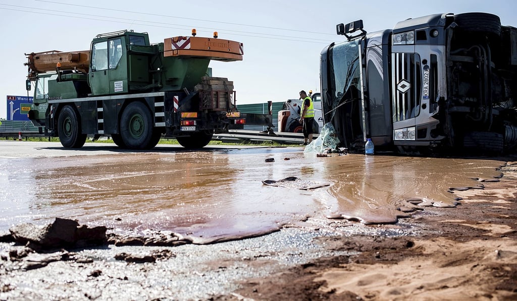 After flipping over, the tanker came to rest across lanes and the chocolate barred traffic in both directions. Photo: AP
