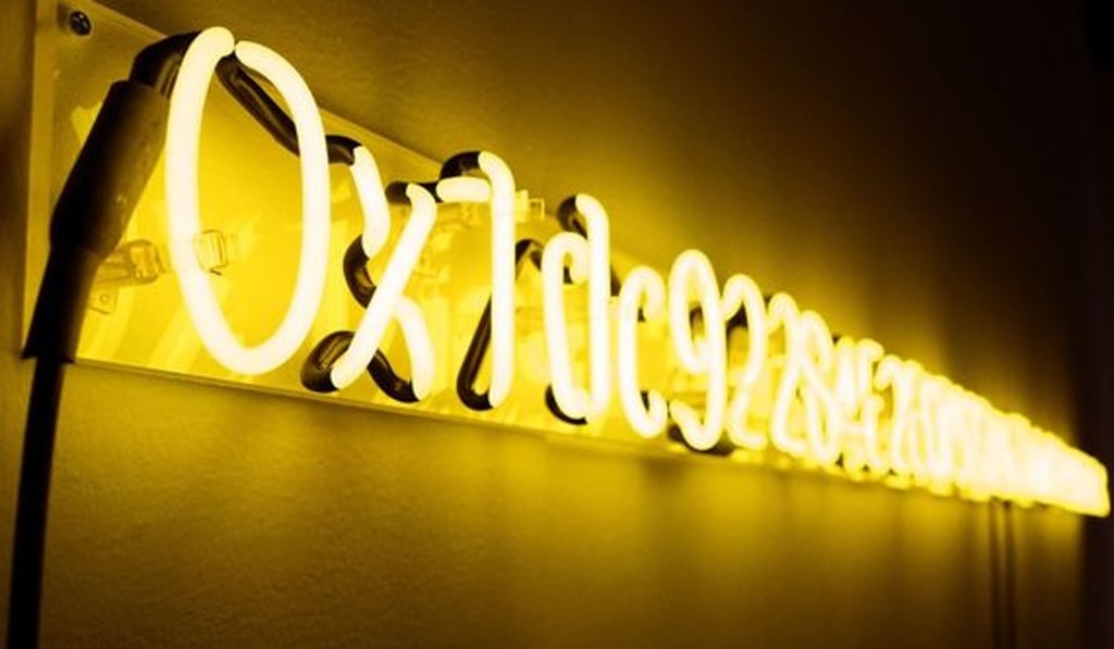 The 10-foot-long neon sign consisting of 42 yellow letters and numbers that make up the blockchain contract address of a crypto-themed work of art called “Yellow Lambo”. Photo: Kevin Abosch The 10-foot-long neon sign consisting of 42 yellow letters and numbers that make up the blockchain contract address of a crypto-themed work of art called “Yellow Lambo”. Photo: Kevin Abosch