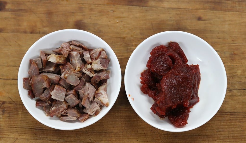 Char siu meat next to the red sauce, before they are mixed together. Photo: Winson Wong