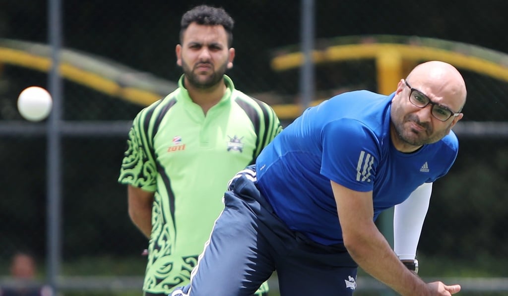 Numan in action during the cricket tournament in Yuen Long. Photo: Winson Wong