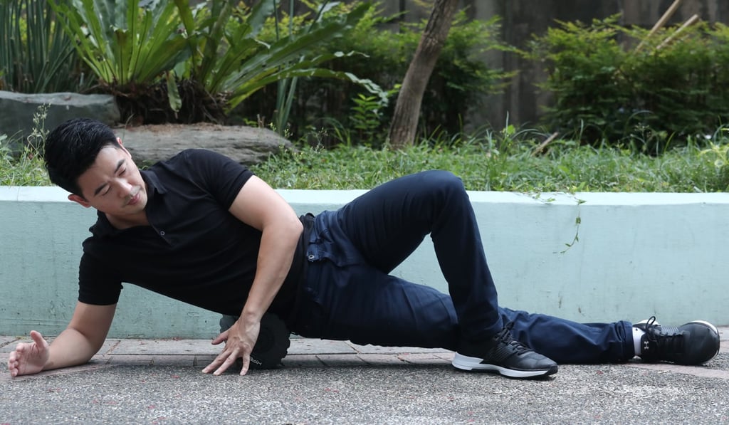 Shaw demonstrates an exercise to improve hip mobility. Photo: Jonathan Wong