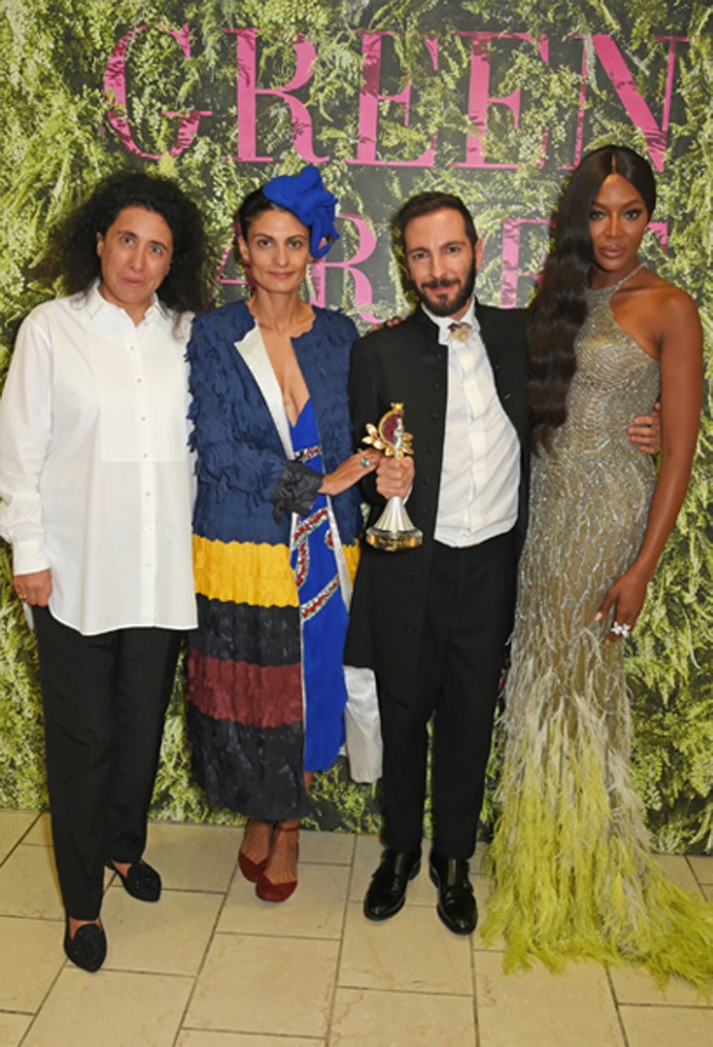 Winner of last year’s Green Carpet Talent Competition, Tiziano Guardini (second from right), with Sara Maino and Naomi Campbell