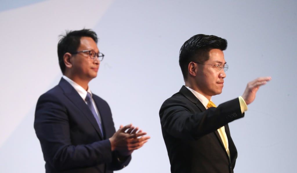Tang with pan-democrat Gary Fan Kwok-wai in Wan Chai as the results for their race came in. Photo: Winson Wong
