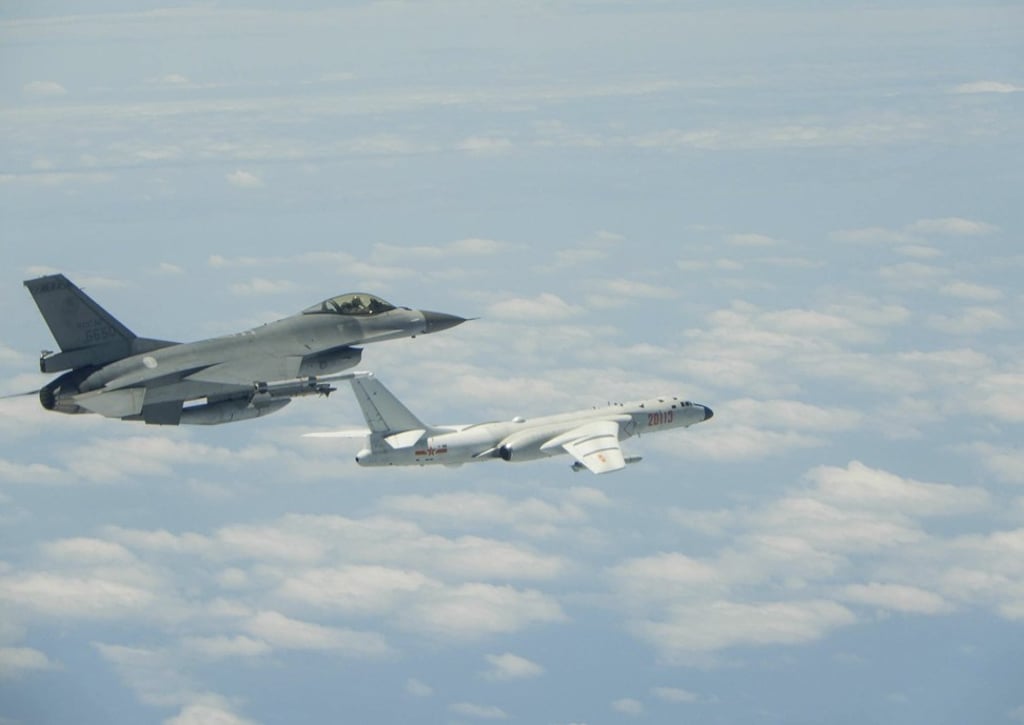 An F-16 fighter jet (left) and H-6K strategic bomber during the drills on Friday. Photo: CNA