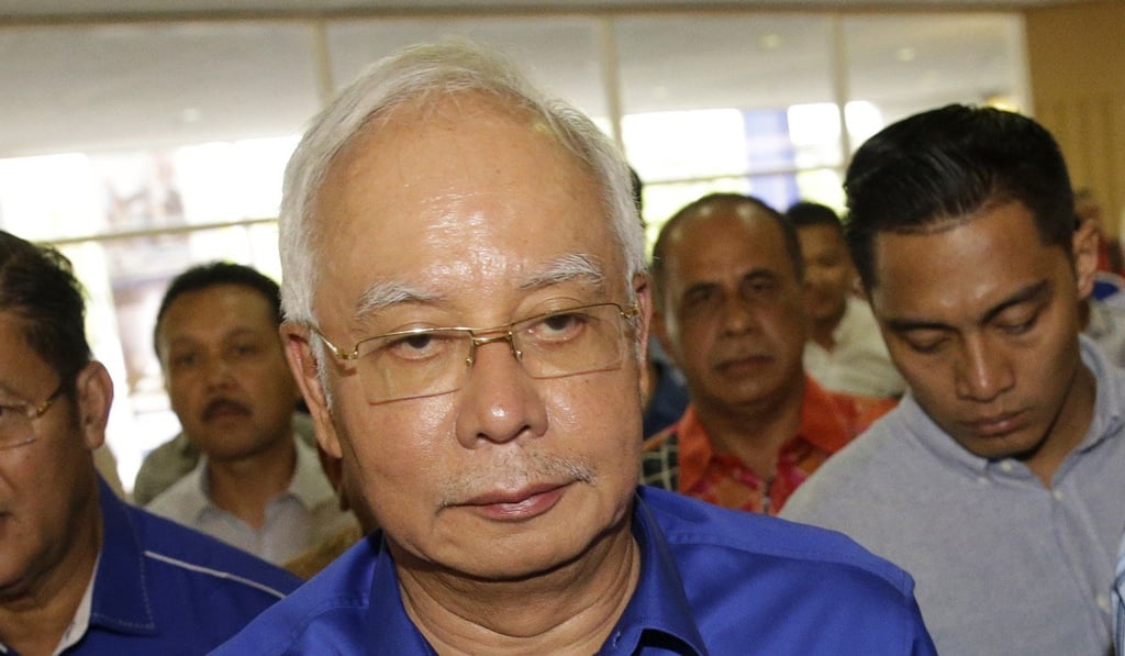 Najib Razak, Malaysia’s former PM, has been banned from leaving the country. Photo: AP Najib Razak, Malaysia’s former PM, has been banned from leaving the country. Photo: AP