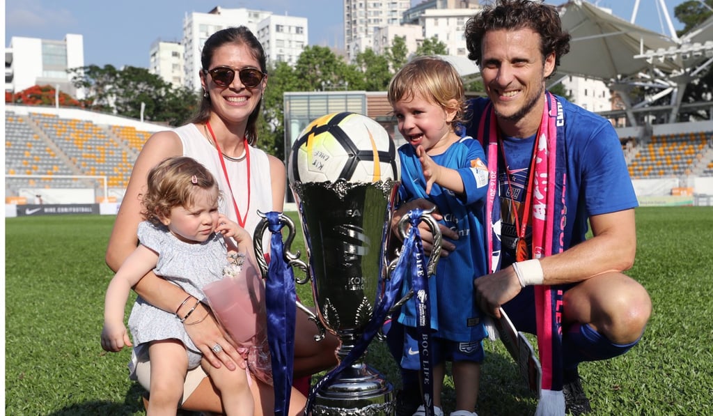 Diego Forlan and family pose with the Hong Kong Premier League trophy.