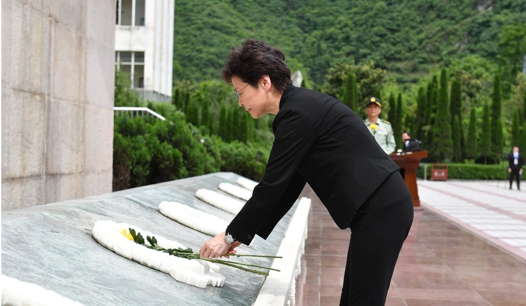 Hong Kong Chief Executive Carrie Lam lays a flower at a ceremony marking the 10th anniversary of the earthquake. Photo: ISD