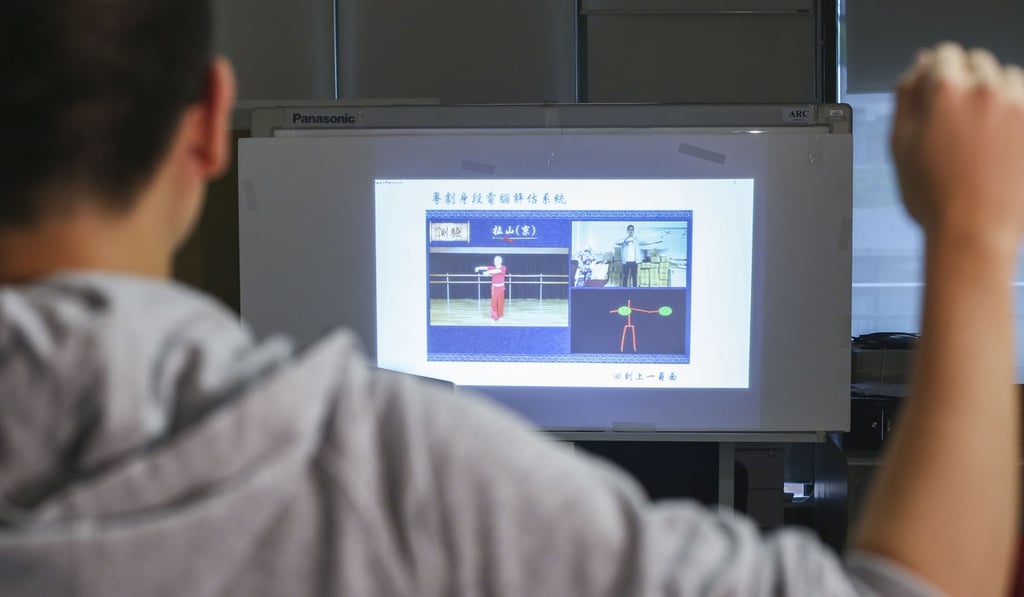 Students learn by following a video demonstration, and a system of sensors score how well they have replicated the movements. Photo: Edmond So