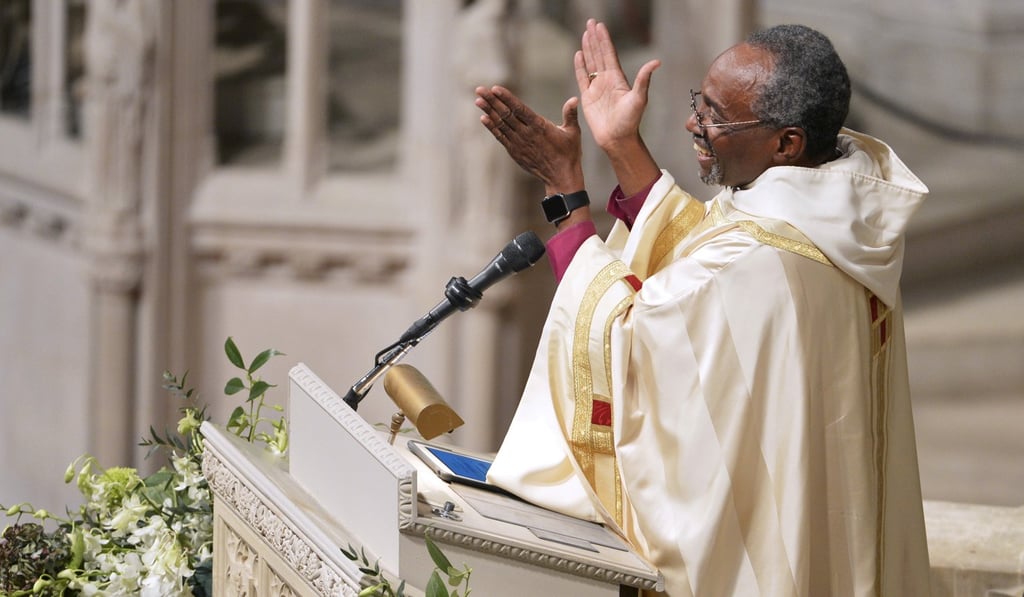 Curry applauds as he begins his sermon after his Installation ceremony at the Washington National Cathedral in Washington, on November 1, 2015. He is the first African-American Episcopal presiding bishop. Photo: Reuters