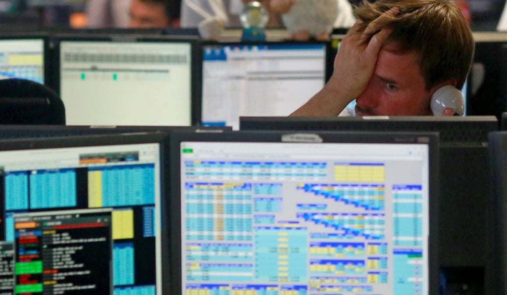 A trader from BGC, a global brokerage company in London's Canary Wharf financial district, reacts as European stock markets open on June 24, 2016, after Britain voted to leave the European Union. Photo: Reuters