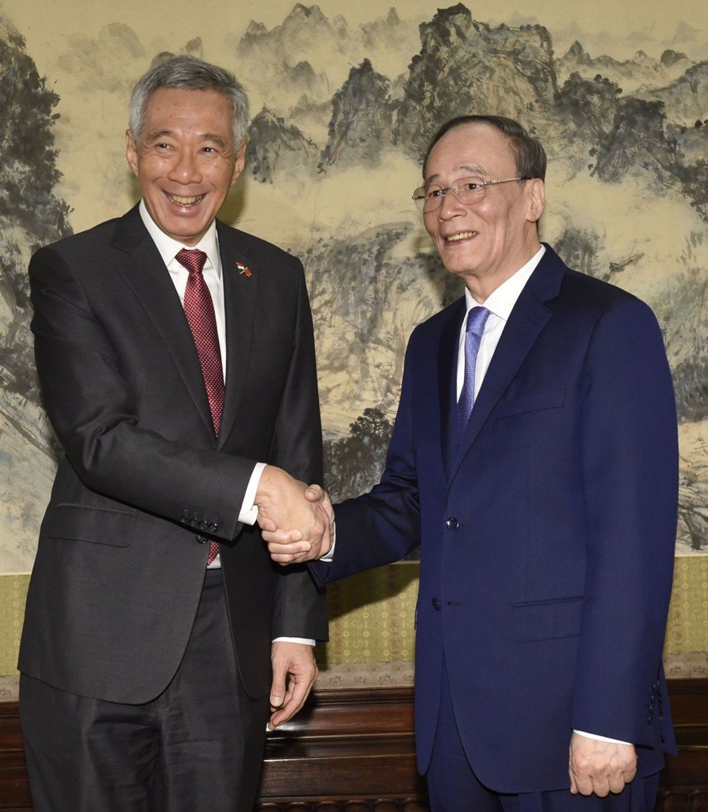 China’s vice-president Wang Qishan (right) shakes hands with Singapore’s Prime Minister Lee Hsien Loong before a meeting in Beijing last month. Photo: Kyodo China’s vice-president Wang Qishan (right) shakes hands with Singapore’s Prime Minister Lee Hsien Loong before a meeting in Beijing last month. Photo: Kyodo