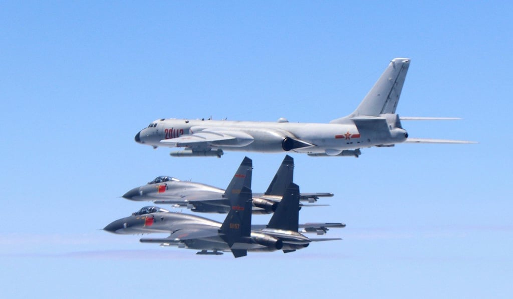Two mainland J-11 fighter jets and a H-6K bomber fly in formation during the exercise. Photo: Xinhua