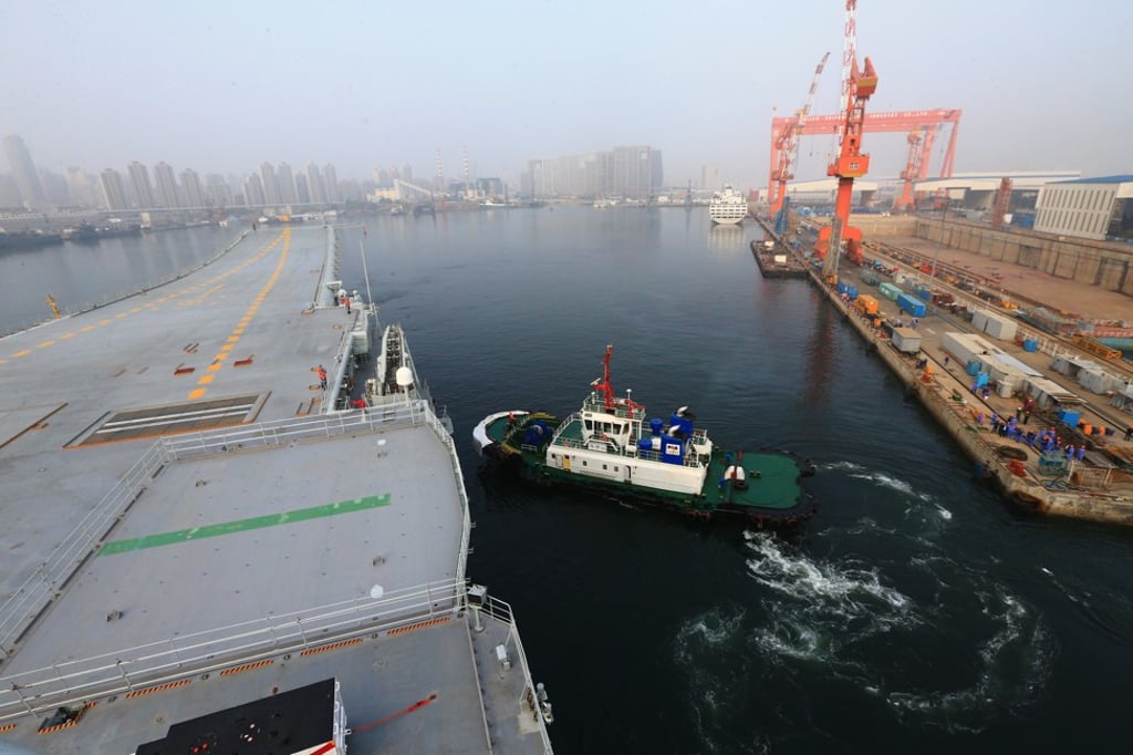 China’s first domestically built aircraft carrier leaves Dalian in northeast China's Liaoning Province for sea trials on Sunday. Photo: Xinhua